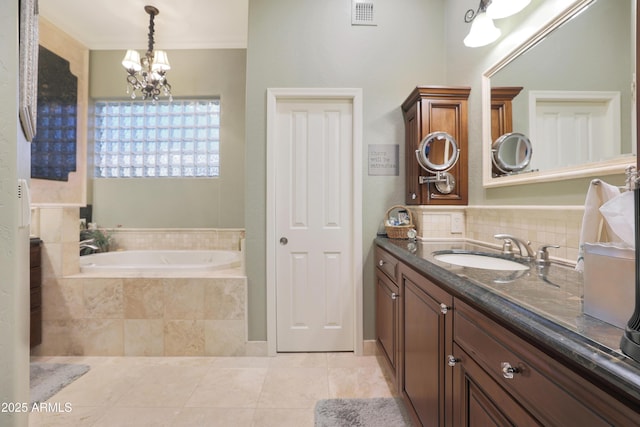 bathroom with vanity, crown molding, a relaxing tiled tub, a chandelier, and tile patterned flooring