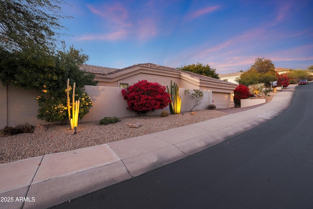 view of front of property featuring a garage