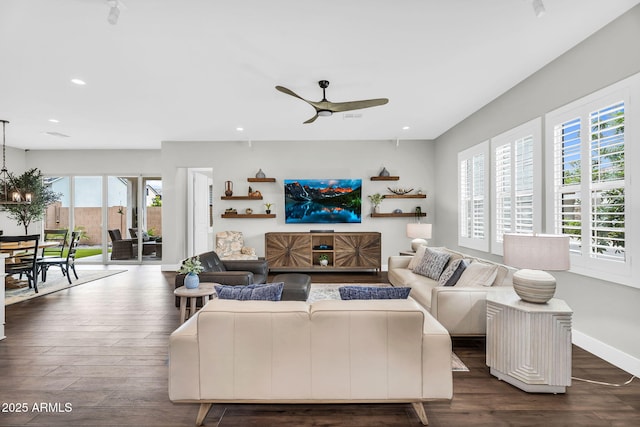 11233 N Blakely St, Surprise, AZ 85388 - living room with a ceiling fan, recessed lighting, dark wood-type flooring, and baseboards