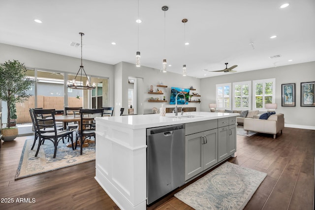11233 N Blakely St, Surprise, AZ 85388 - kitchen with stainless steel dishwasher, a sink, light countertops, gray cabinets, and open floor plan