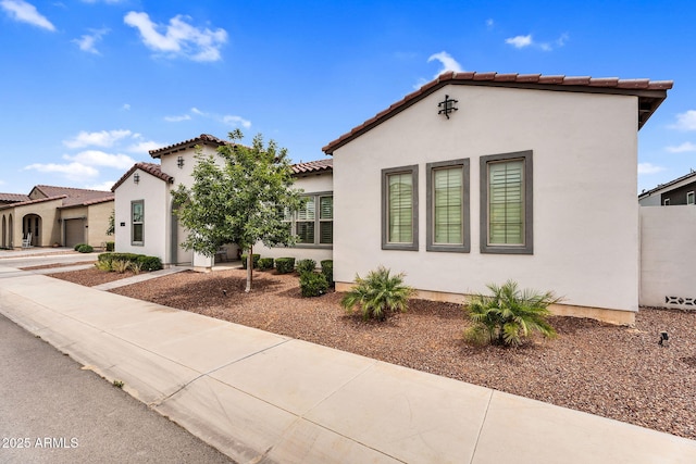 11233 N Blakely St, Surprise, AZ 85388 - mediterranean / spanish-style home with a tile roof and stucco siding