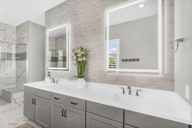 11233 N Blakely St, Surprise, AZ 85388 - bathroom with a marble finish shower, double vanity, and marble look tiles