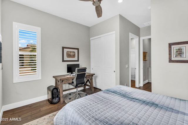 11233 N Blakely St, Surprise, AZ 85388 - bedroom featuring dark wood-style floors, baseboards, a closet, an office area, and a ceiling fan