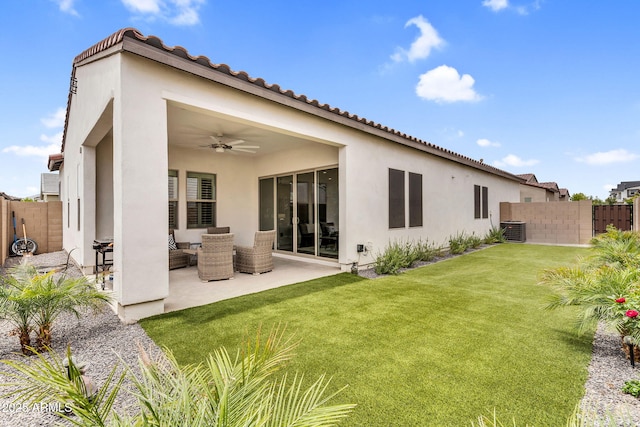 11233 N Blakely St, Surprise, AZ 85388 - back of house with central AC, a ceiling fan, a patio area, stucco siding, and an outdoor hangout area