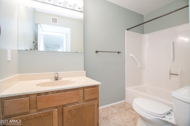 full bathroom featuring toilet, tile floors, vanity, and tub / shower combination