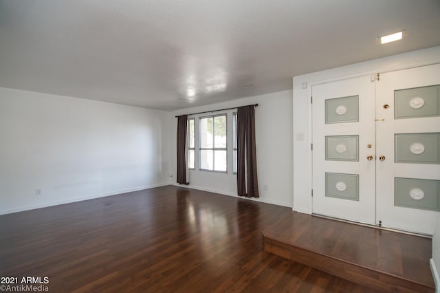 empty room featuring dark hardwood / wood-style floors