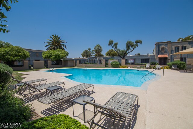 view of swimming pool with a patio