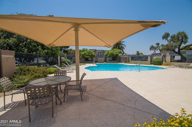 view of pool featuring a patio area