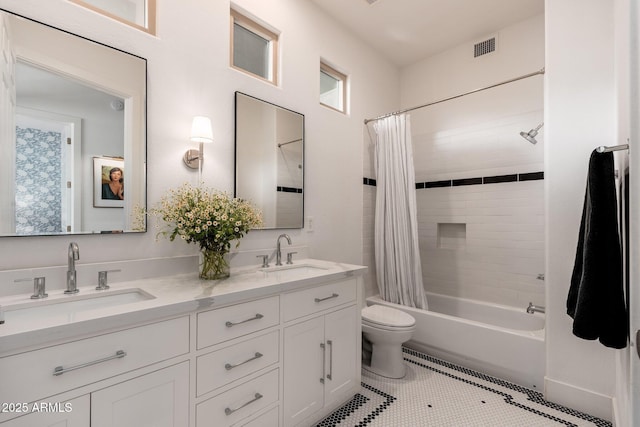 bathroom with toilet, shower / tub combo, double vanity, and tile patterned flooring
