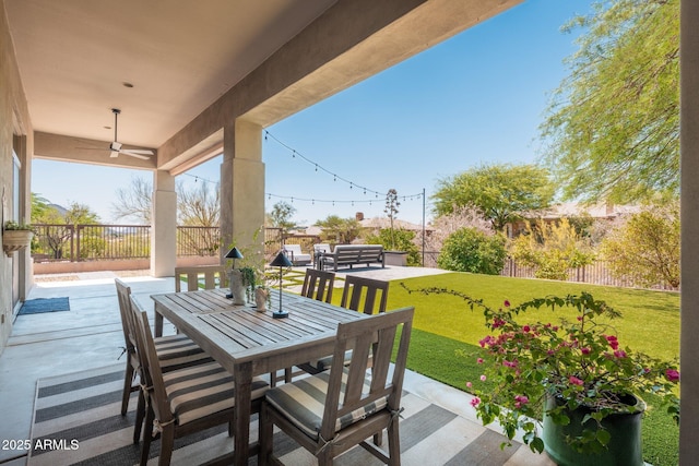 view of patio with a ceiling fan and outdoor dining area
