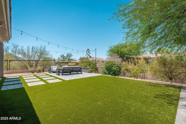 view of yard with a patio area and an outdoor living space
