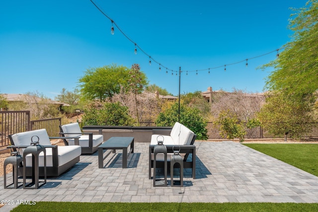 view of patio / terrace with outdoor lounge area and fence
