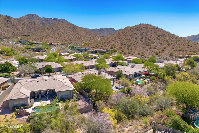 aerial view of residential area featuring a mountainous background