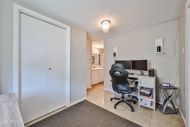11815 N 112th Dr, Youngtown, AZ 85363 - office area featuring light tile patterned flooring and baseboards
