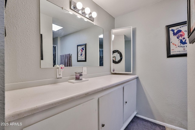 11815 N 112th Dr, Youngtown, AZ 85363 - bathroom featuring vanity and a textured wall