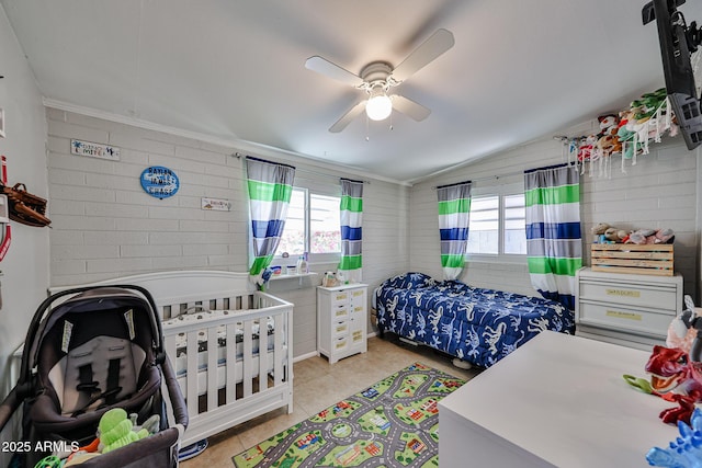 11815 N 112th Dr, Youngtown, AZ 85363 - bedroom with light tile patterned floors, vaulted ceiling, a ceiling fan, and ornamental molding