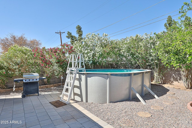 11815 N 112th Dr, Youngtown, AZ 85363 - view of patio / terrace with grilling area and a fenced backyard