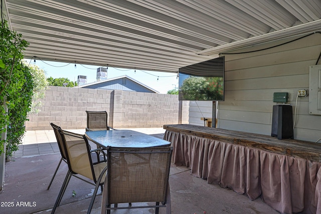 11815 N 112th Dr, Youngtown, AZ 85363 - view of patio featuring outdoor dining area and fence