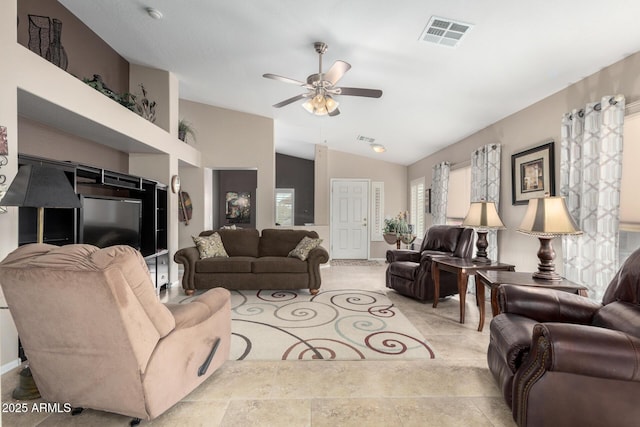 living room featuring ceiling fan and lofted ceiling