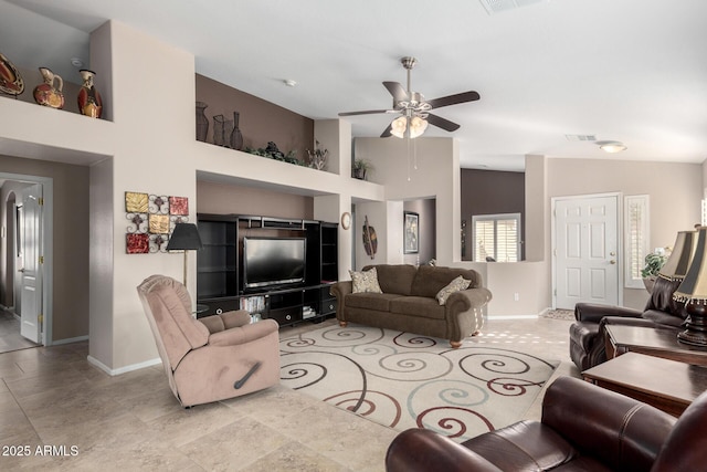 living room featuring ceiling fan and vaulted ceiling