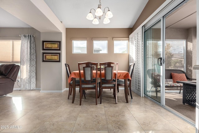 dining room featuring a notable chandelier