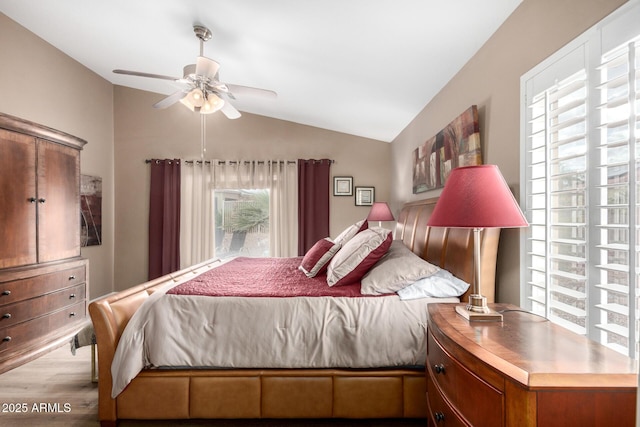 bedroom with vaulted ceiling, ceiling fan, and light hardwood / wood-style floors