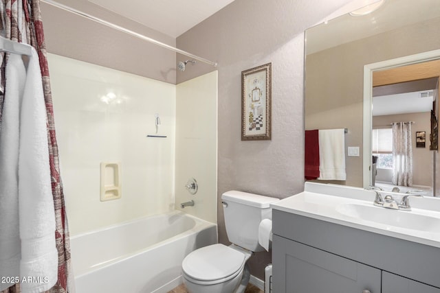 full bathroom featuring toilet, vanity, and shower / bathtub combination