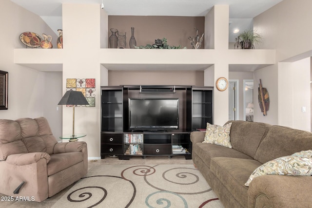 living room featuring built in shelves and light carpet