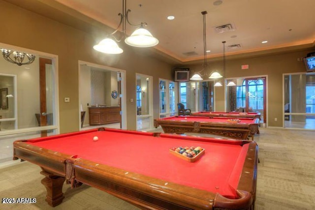 rec room with light colored carpet, billiards, and a raised ceiling