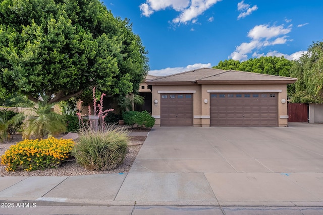 2160 E Kenwood St, Mesa, AZ 85213 - view of front of property with an attached garage, stucco siding, concrete driveway, and a tile roof