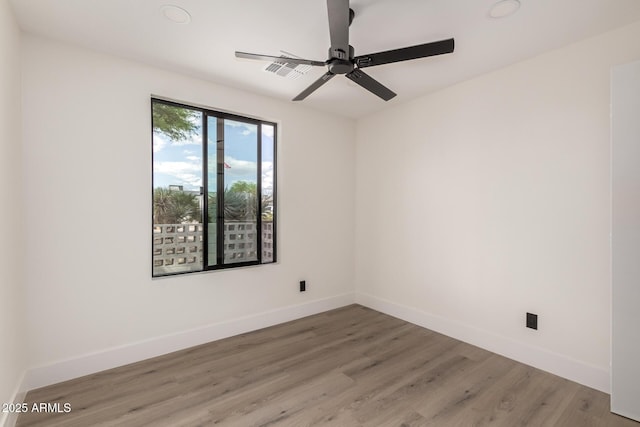 4019 E Surrey Ave, Phoenix, AZ 85032 - empty room with light wood finished floors, visible vents, baseboards, and ceiling fan