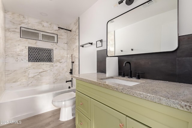 4019 E Surrey Ave, Phoenix, AZ 85032 - full bathroom featuring shower / bathtub combination, vanity, visible vents, toilet, and wood finished floors
