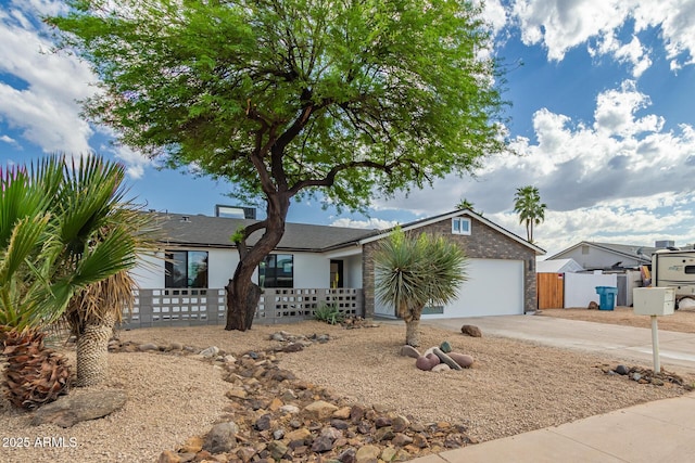 4019 E Surrey Ave, Phoenix, AZ 85032 - ranch-style home with a garage, driveway, and fence