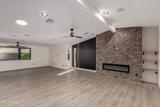 4019 E Surrey Ave, Phoenix, AZ 85032 - unfurnished living room featuring wood finished floors, a ceiling fan, and visible vents