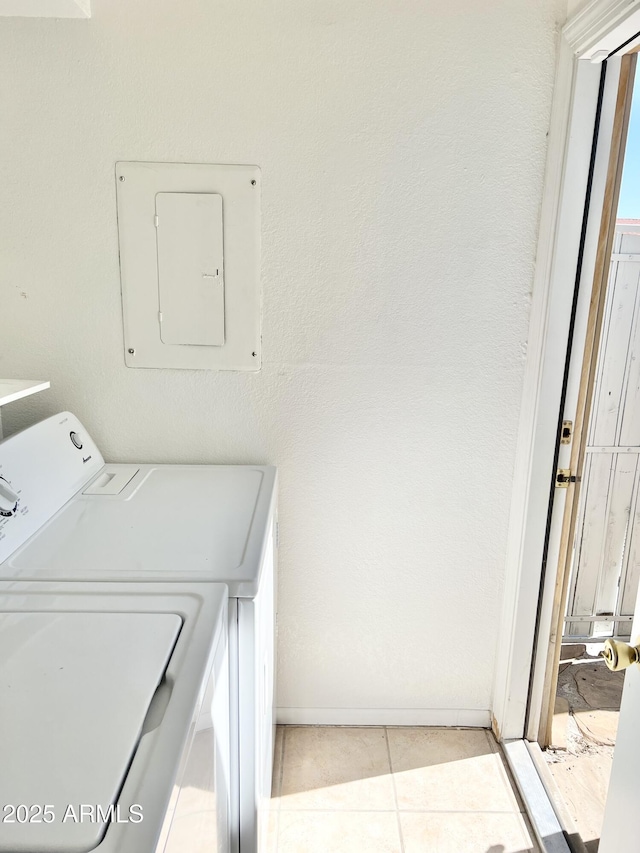 19601 N 7th St Ave Unit 1036, Phoenix, AZ 85024 - washroom with electric panel, washer / dryer, light tile patterned flooring, and baseboards
