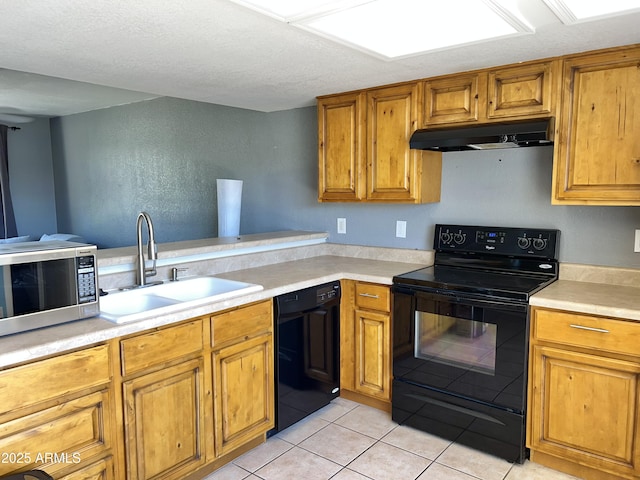 19601 N 7th St Ave Unit 1036, Phoenix, AZ 85024 - kitchen with black appliances, under cabinet range hood, a sink, and brown cabinetry