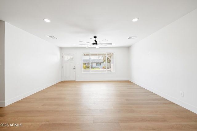 unfurnished living room with ceiling fan, recessed lighting, baseboards, and light wood finished floors
