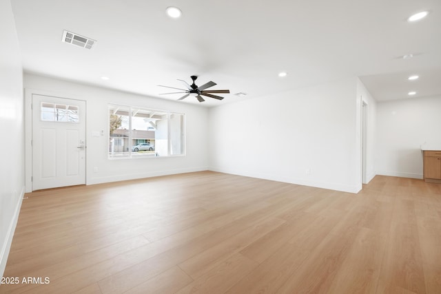 unfurnished living room with a ceiling fan, light wood-style floors, recessed lighting, and baseboards