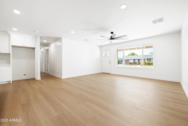unfurnished living room with a ceiling fan, recessed lighting, baseboards, and light wood-style floors