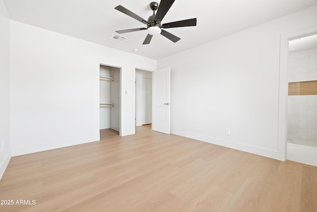 unfurnished bedroom featuring light wood finished floors, a closet, baseboards, and ceiling fan