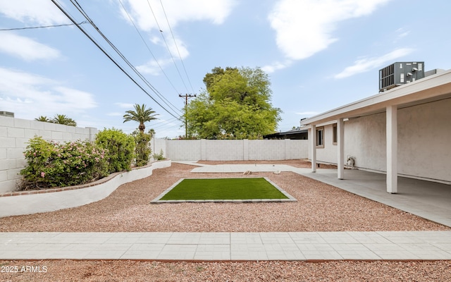 fenced backyard with a patio