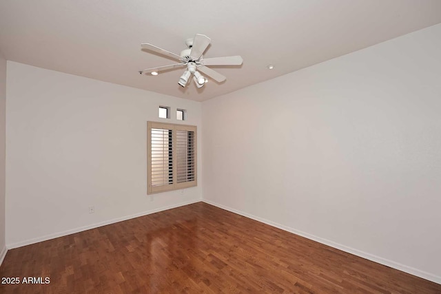 empty room featuring hardwood / wood-style floors and ceiling fan