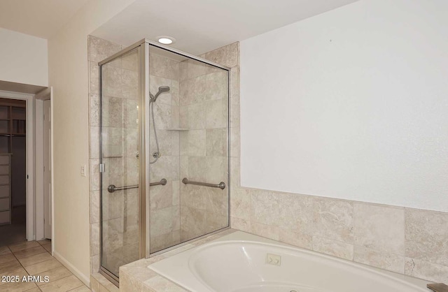 bathroom featuring plus walk in shower and tile patterned flooring