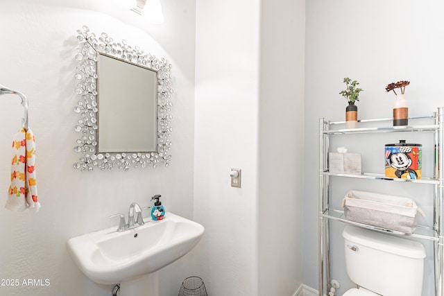bathroom with a sink and toilet