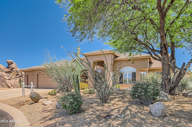 view of front of property with a garage