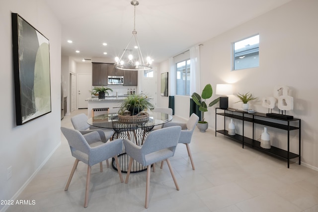 dining area featuring baseboards, a chandelier, and recessed lighting