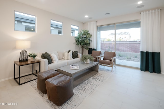 living room featuring recessed lighting, visible vents, and baseboards