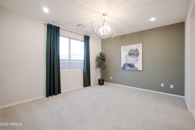 carpeted spare room featuring a chandelier, recessed lighting, visible vents, and baseboards