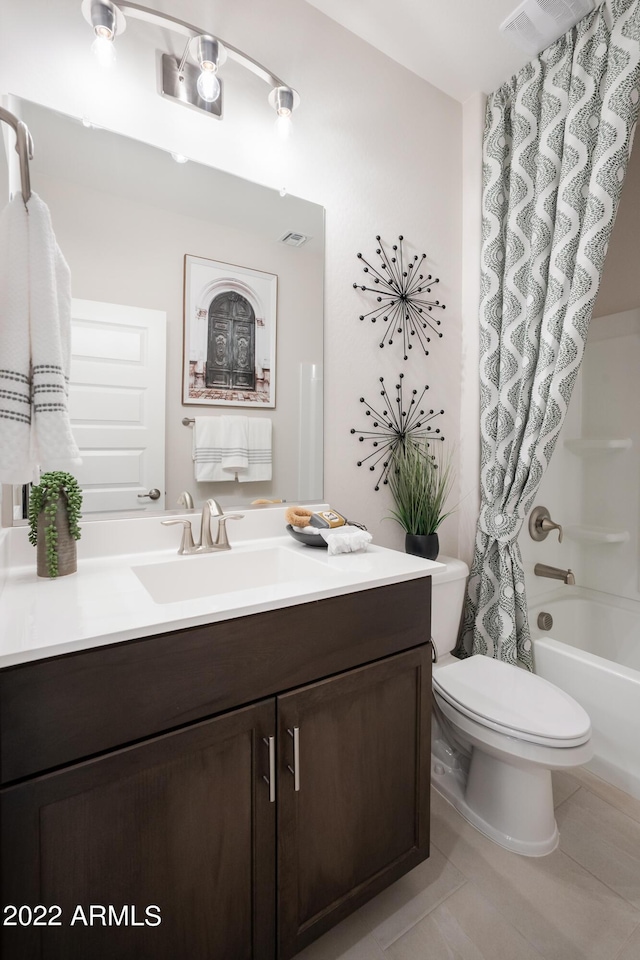 full bath with toilet, tile patterned floors, visible vents, vanity, and shower / tub combo with curtain