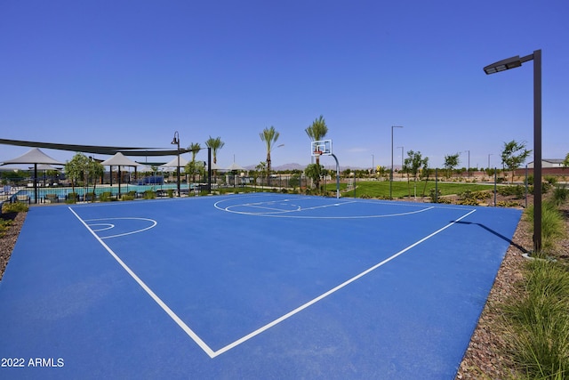 view of sport court featuring community basketball court and fence